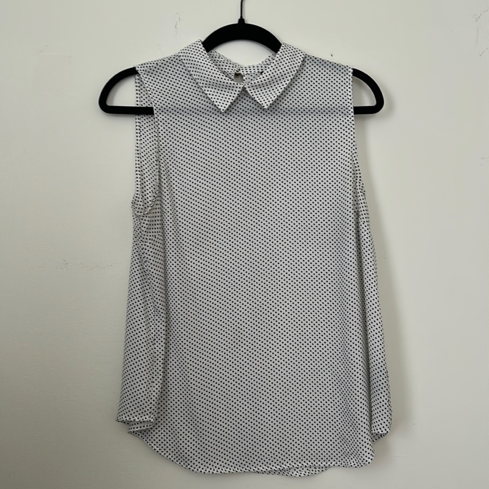 Sheer sleeveless black polka dot blouse with brass buttons